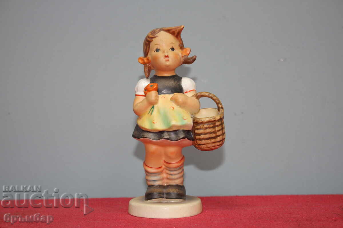 Hummel porcelain figurine girl with basket.