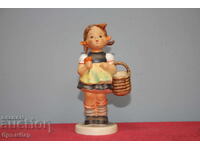 Hummel porcelain figurine girl with basket.