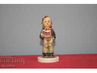 Hummel porcelain figurine of a singing boy.