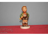 Hummel porcelain figurine boy with trumpet.