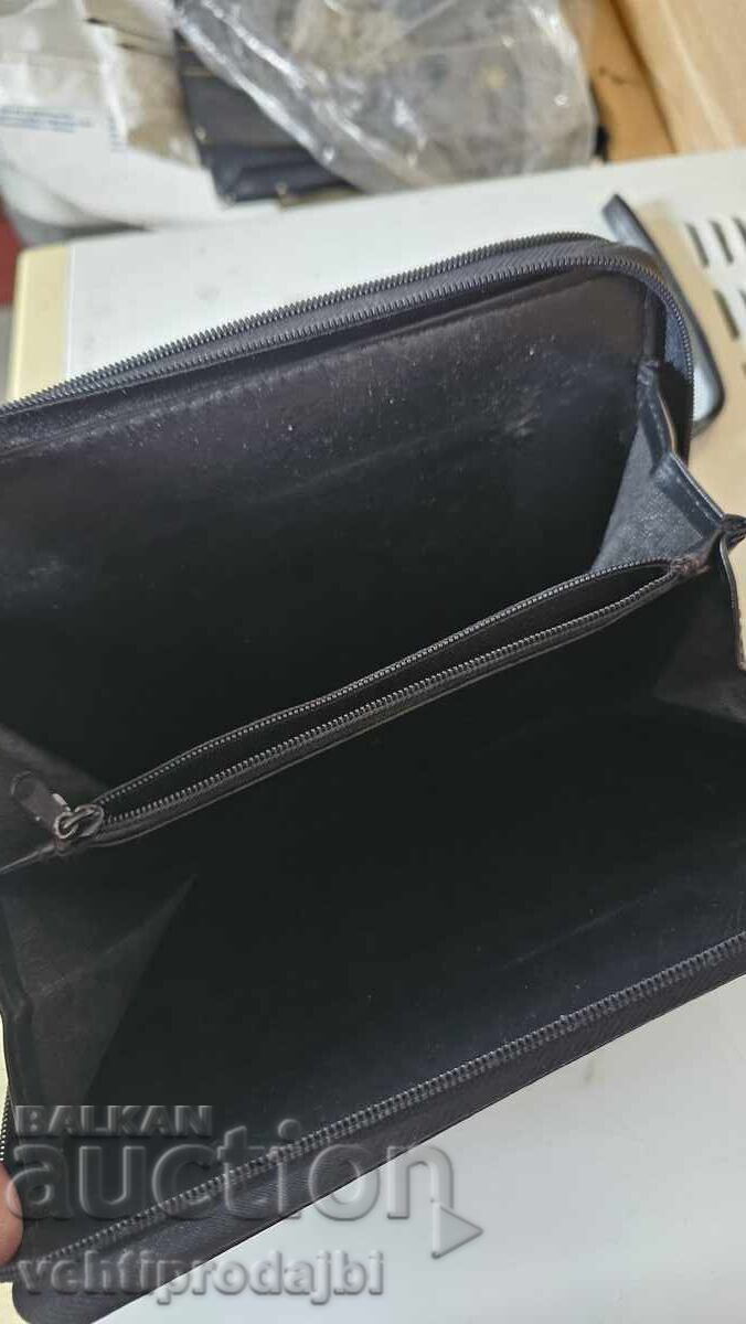 Delivery of Toiletry bag with calculator, notebook and wallet Delivery of Toiletry bag with calculator, notebook and wallet