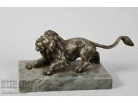 Old metal sculpture, lion, patina