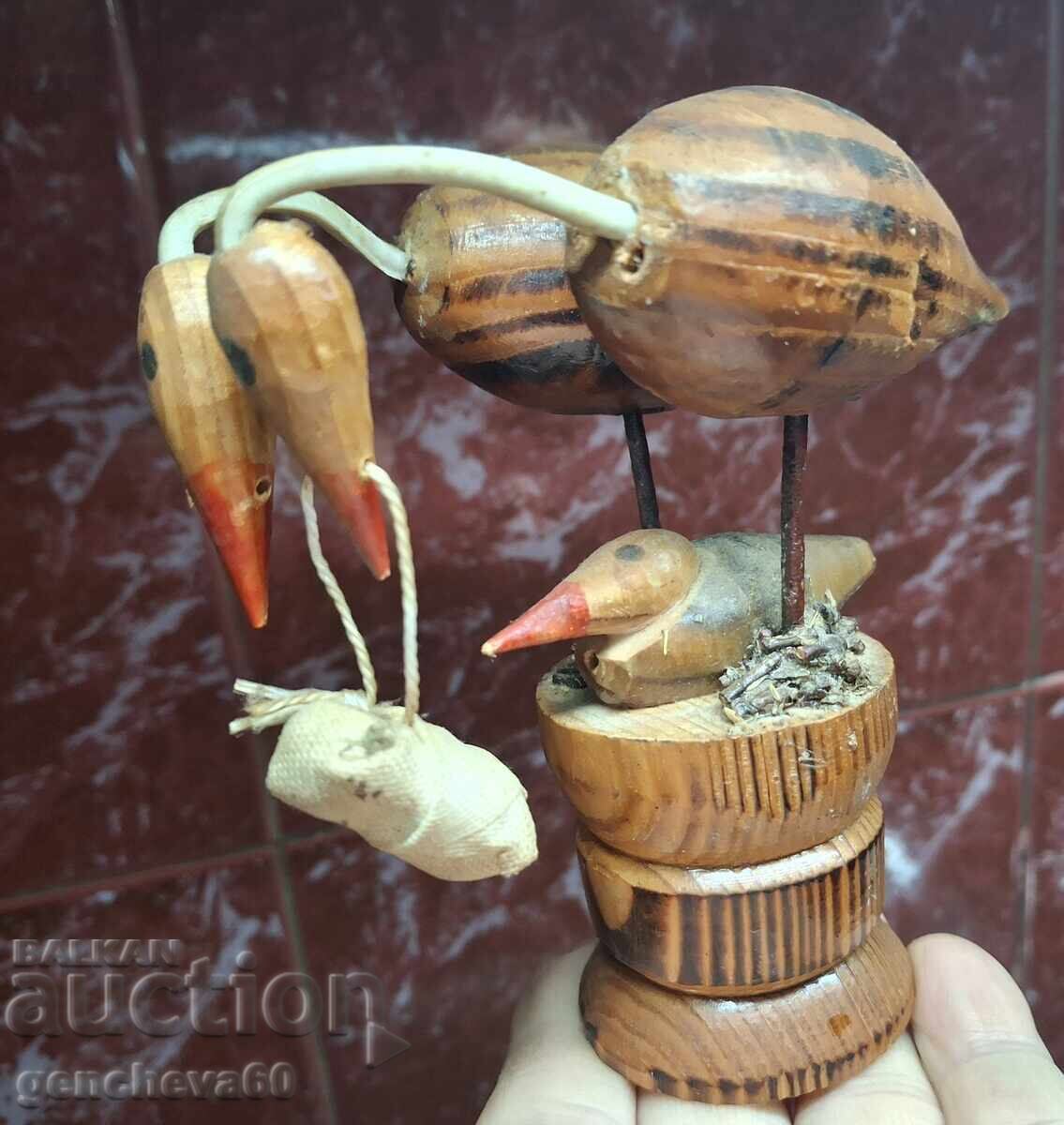 Old wooden stork figurine