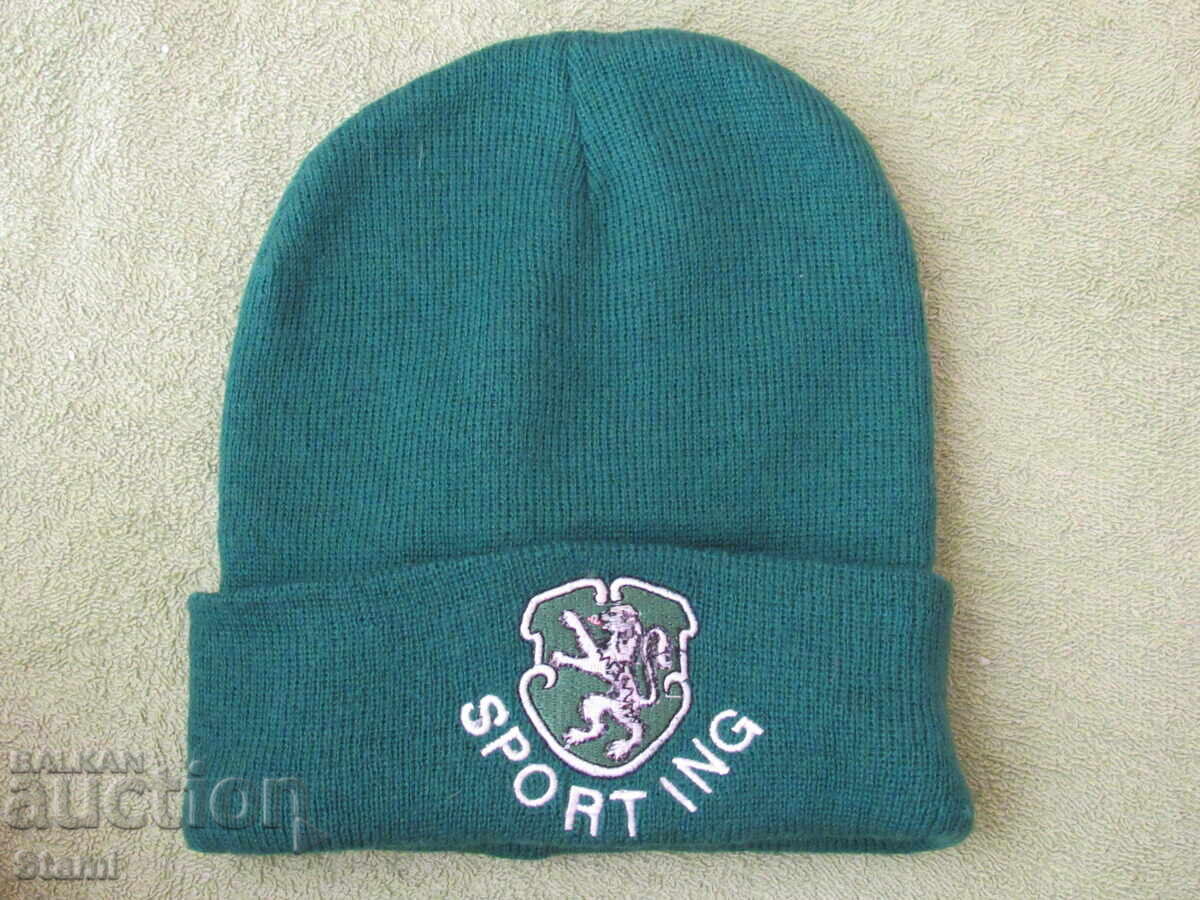 Knitted green hat with emblem, new