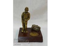 Bronze sculpture - Miner and pyrite stone.