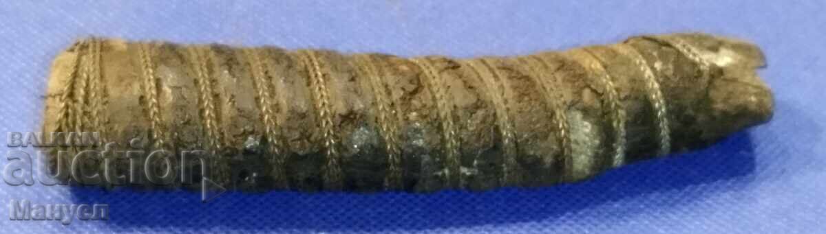 A sword handle. - 5 A sword handle. - 5