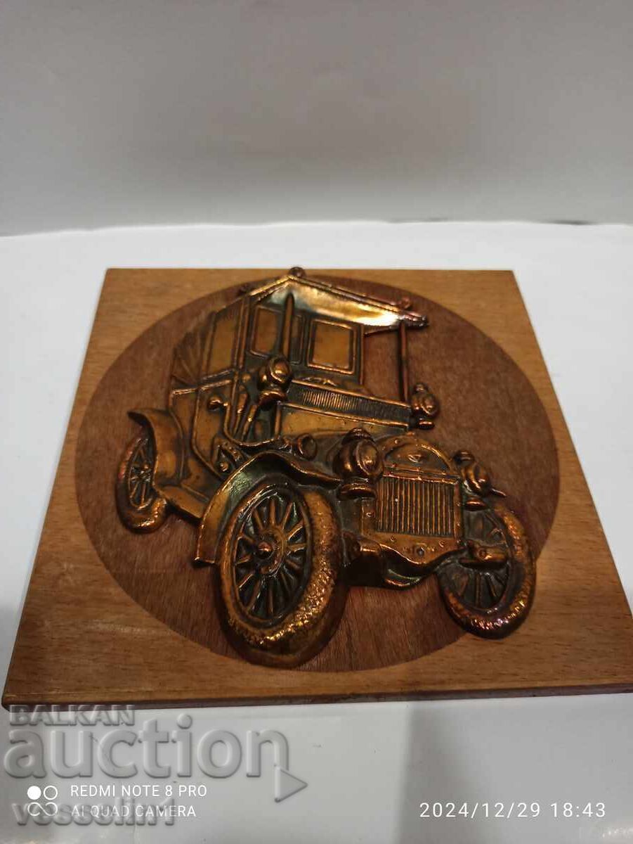 Old metal plate car from Soca car made of copper and embossed Old metal plate car from Soca car made of copper and embossed