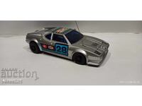 Old stroller with remote control BMW M1 in a box retro car BMW