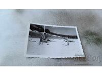 Photo Woman and two children on the beach