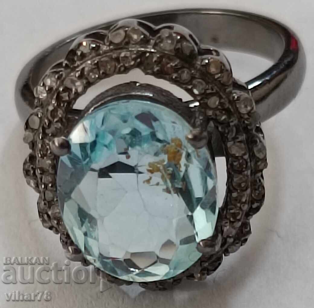 Auction  silver ring with aquamarine and surrounded by a scale of diamonds