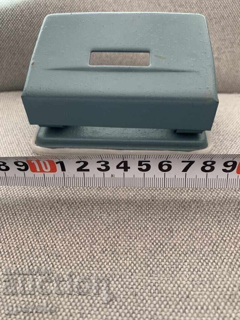 A big old paper punch from socialism