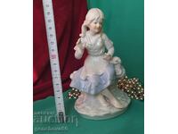 Beautiful porcelain figurine-label