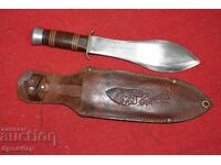 Throwing knife with leather sheath.