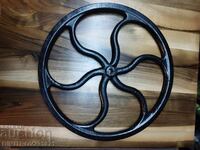 Cast iron sewing machine wheel.