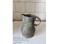 Old copper jug.