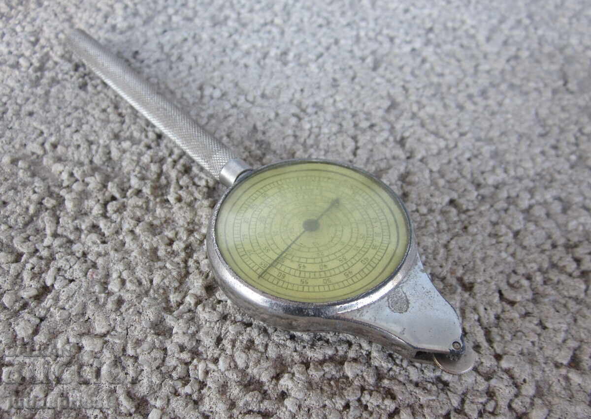 old mechanical device, a device for reading maps, a cruciform old mechanical device, a device for reading maps, a cruciform