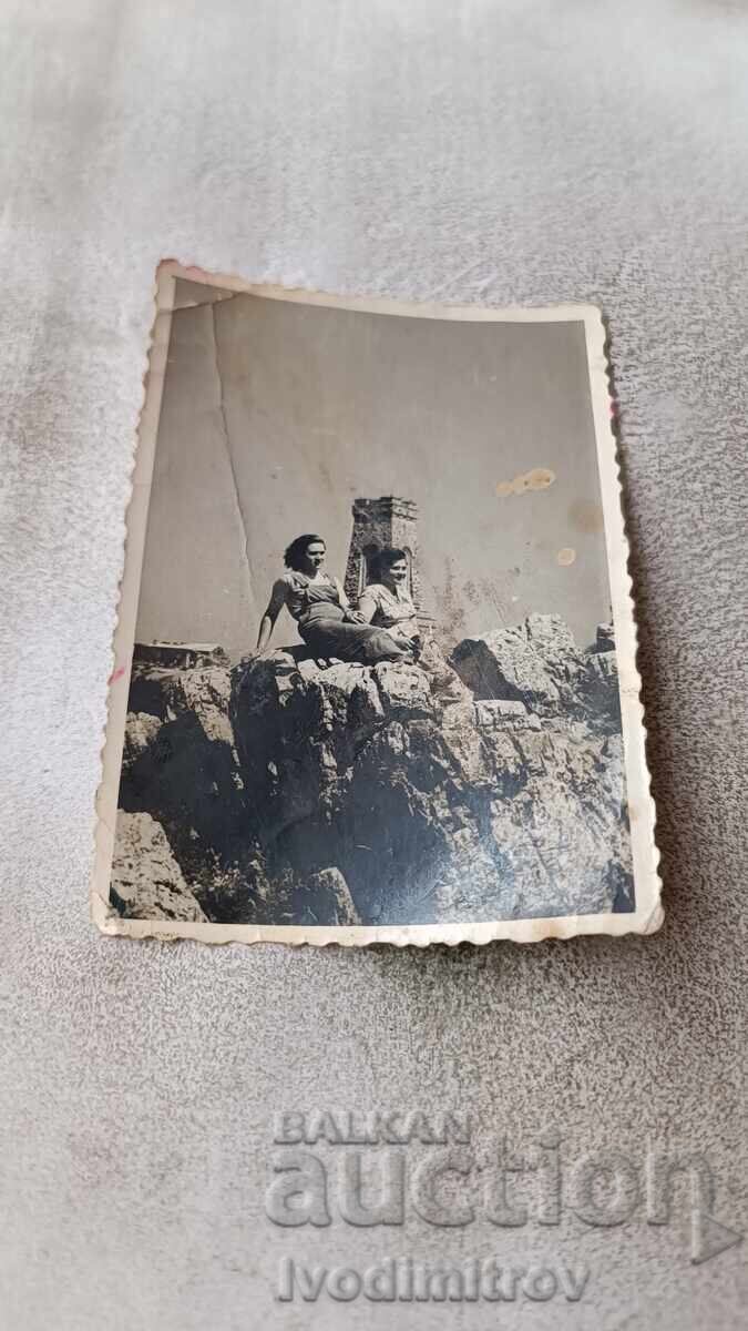 Photo Two women in front of the monument on Mount Shipka Photo Two women in front of the monument on Mount Shipka
