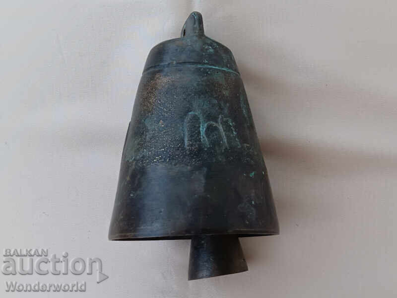 Old gong with a long, sustained ring Old gong with a long, sustained ring