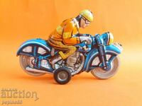 Old toy tin biker