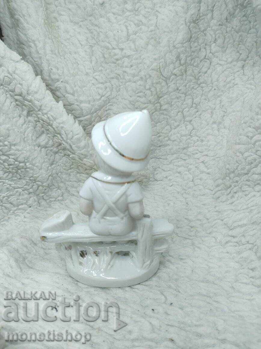 Auction Boy on a bench figurine - old porcelain Auction Boy on a bench figurine - old porcelain