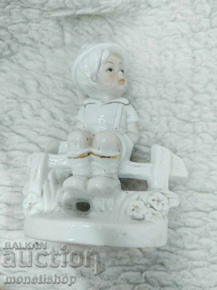 Boy on a bench figurine - old porcelain Boy on a bench figurine - old porcelain