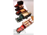 Old, handmade trucks made of wood.