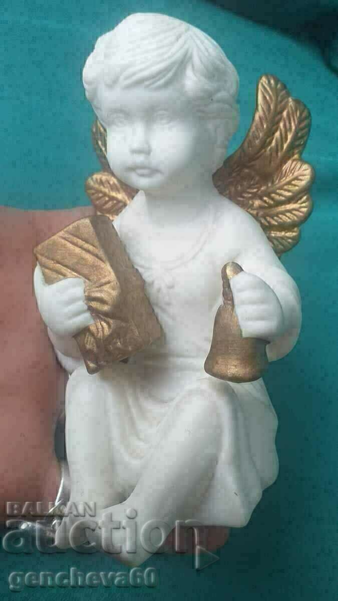 Auction  An alabaster angel figure