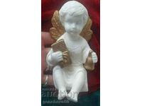 An alabaster angel figure