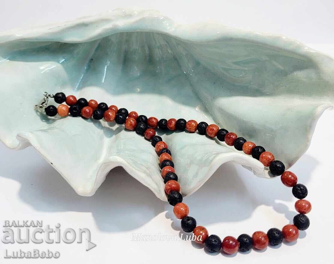 Necklace made of volcanic stone beads Lava and red coral. Necklace made of volcanic stone beads Lava and red coral.