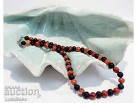 Necklace made of volcanic stone beads Lava and red coral.