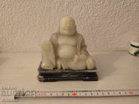 old Chinese sculpture of the happy Buddha