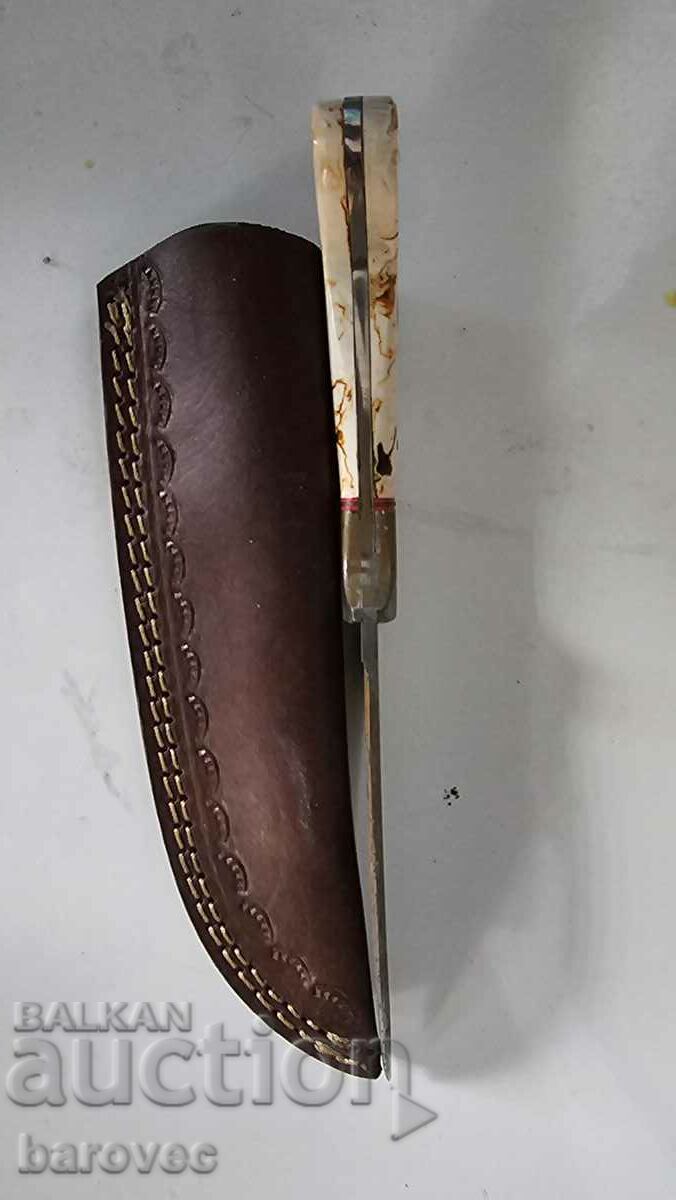 Auction  An old knife with a thread and a leather handle