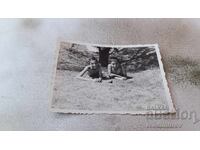 Photo Two boys lying on the grass