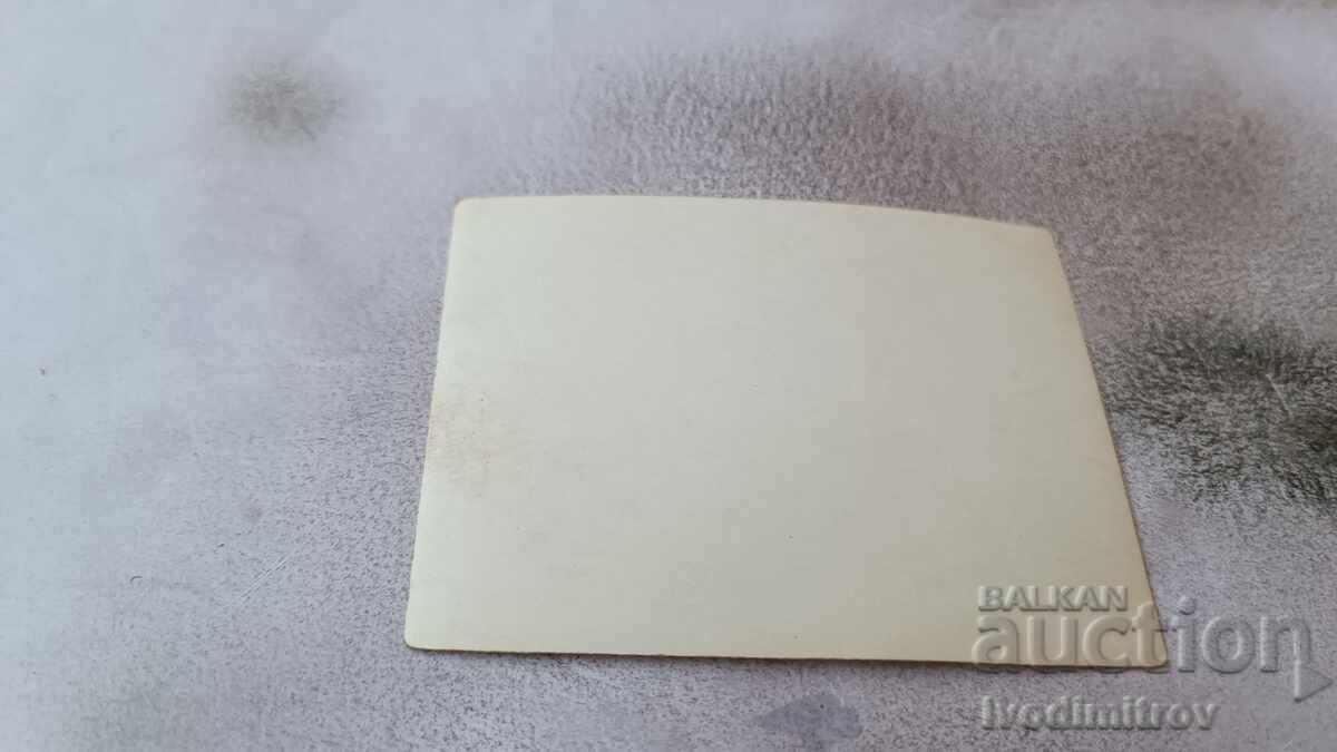 Photo A man and two young girls on the beach with price 1.65 BGN | € 0.84