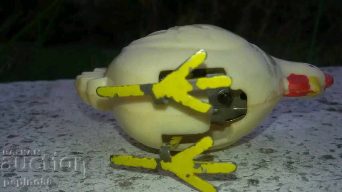 Delivery of Old mechanical toy jumping chicken Delivery of Old mechanical toy jumping chicken