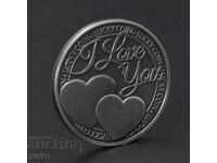 Coin with inscription "I love you" with heart and clover, hearts