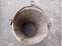 Old wooden bucket with metal fittings