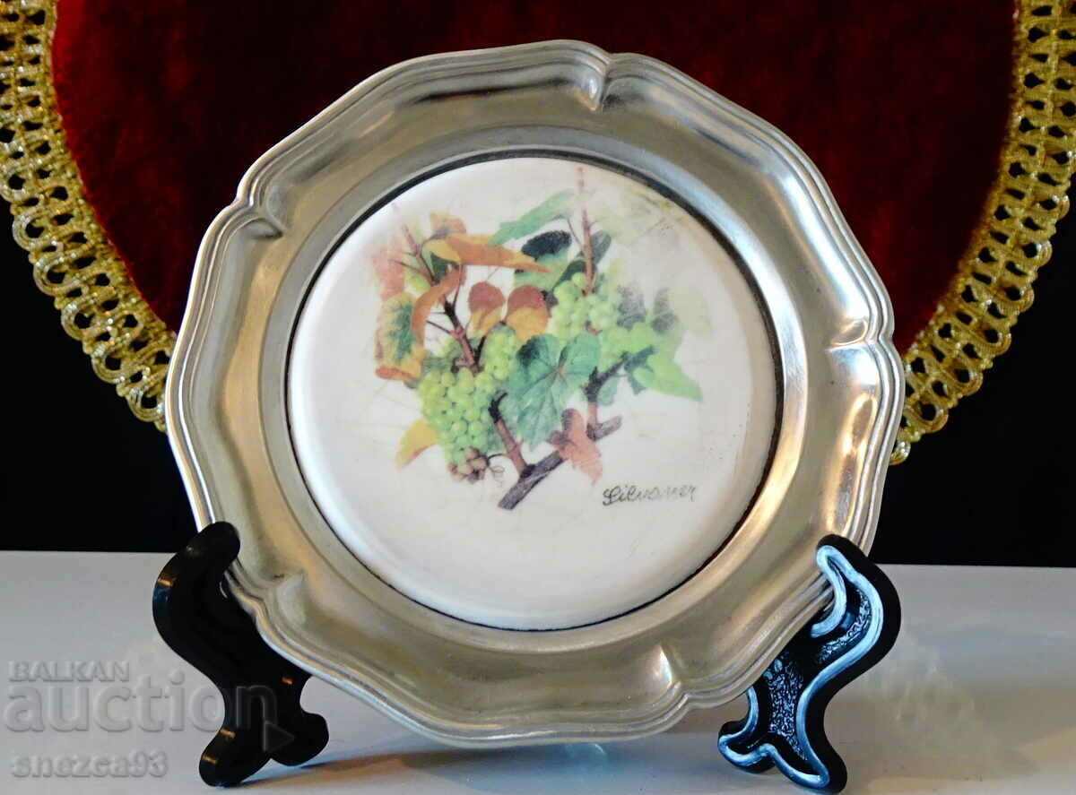 Delivery of A pewter plate with a variety of vines, marked. Delivery of A pewter plate with a variety of vines, marked.