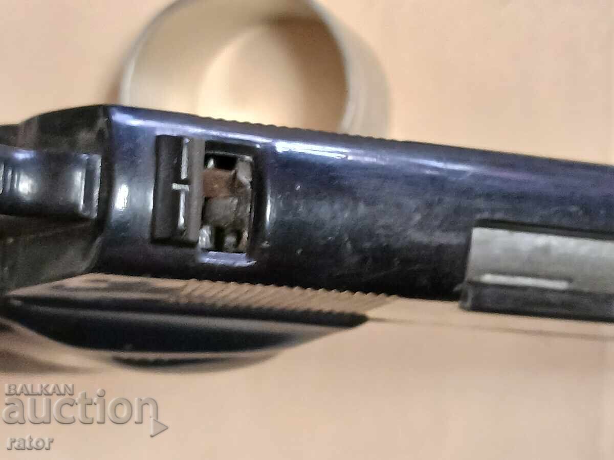 Old toy - a gun with caps - 6