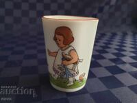 Porcelain cup with children's motifs