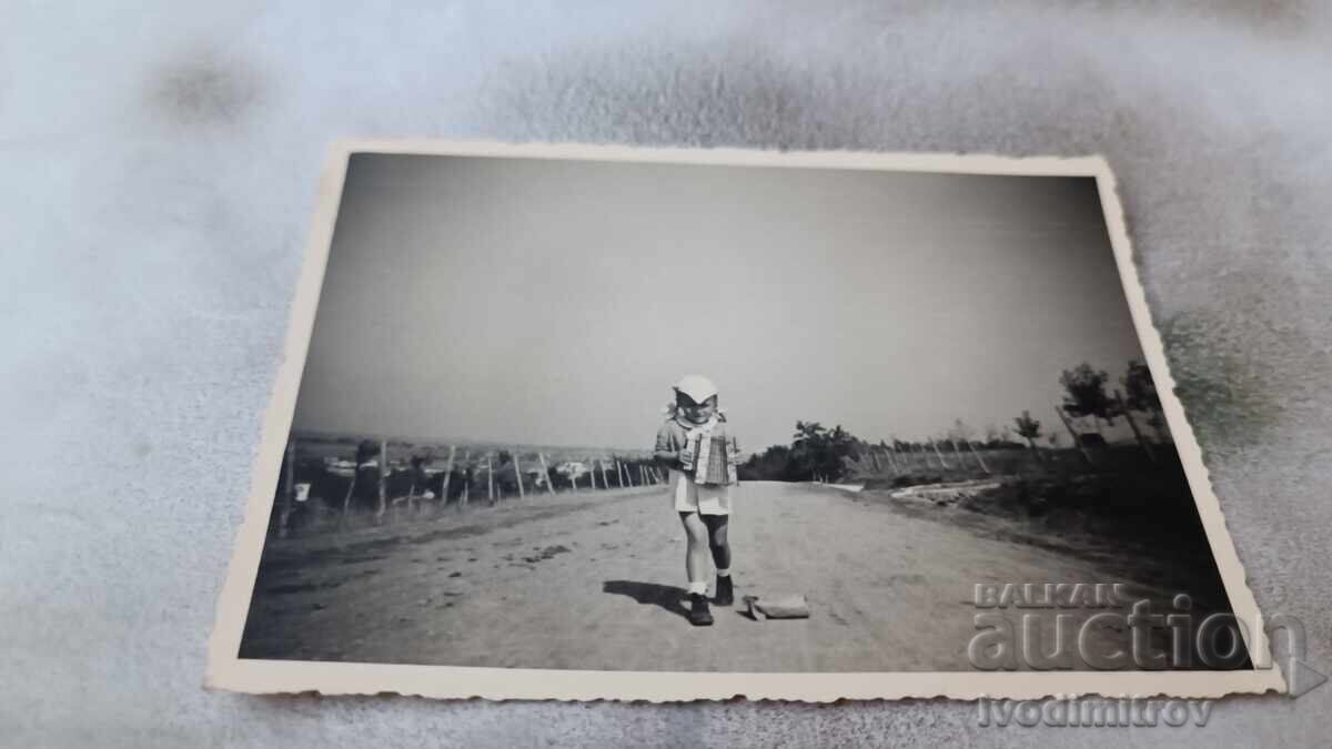 Photo Little girl with an accordion on the road 1942 Photo Little girl with an accordion on the road 1942