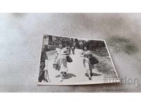 Photo Oreshak Two women carrying plates on the street 1951