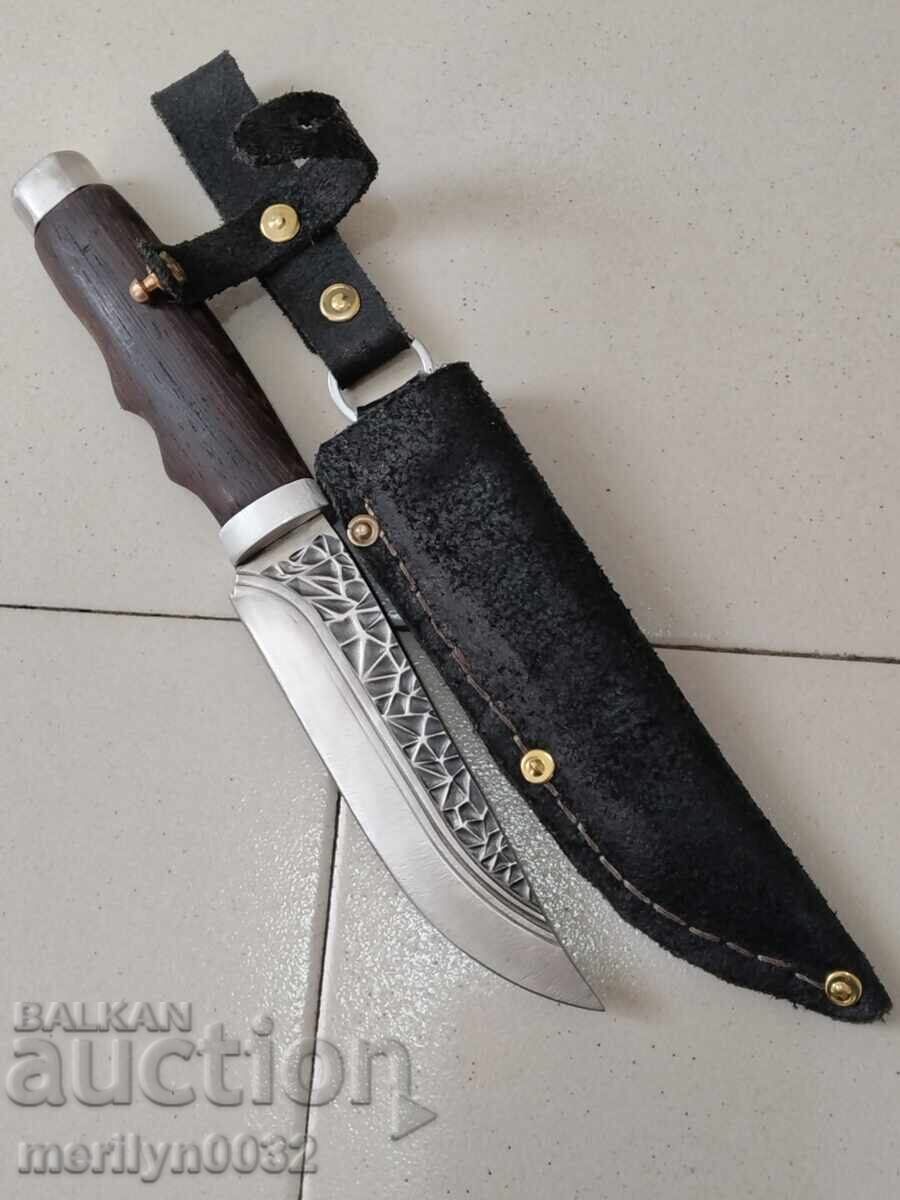 An old tourist knife with a dagger blade An old tourist knife with a dagger blade