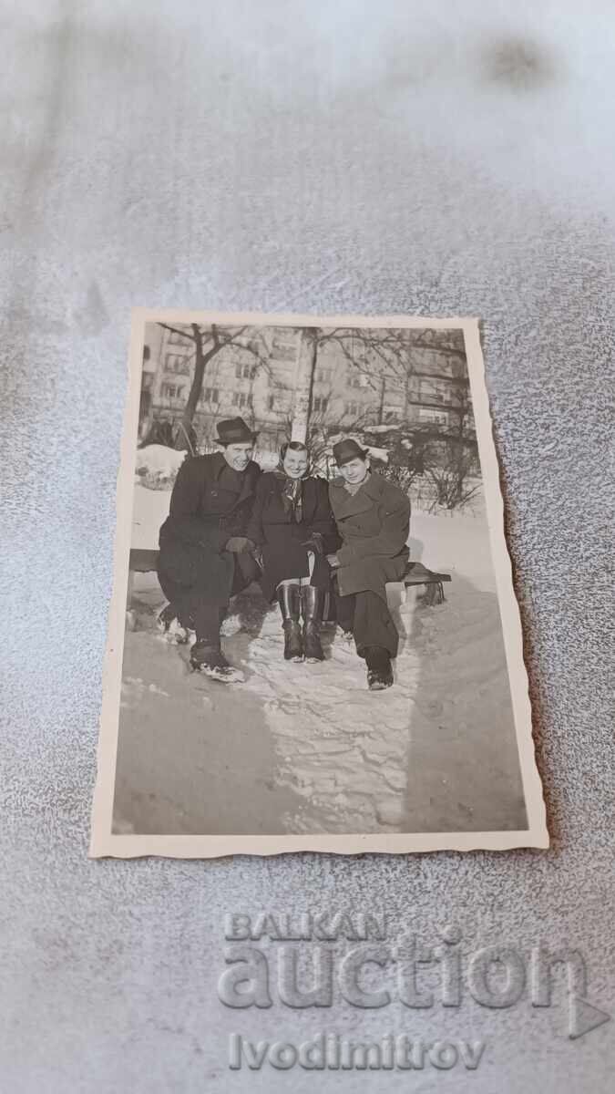 Photo Sofia Two men and a woman on a bench in winter Photo Sofia Two men and a woman on a bench in winter