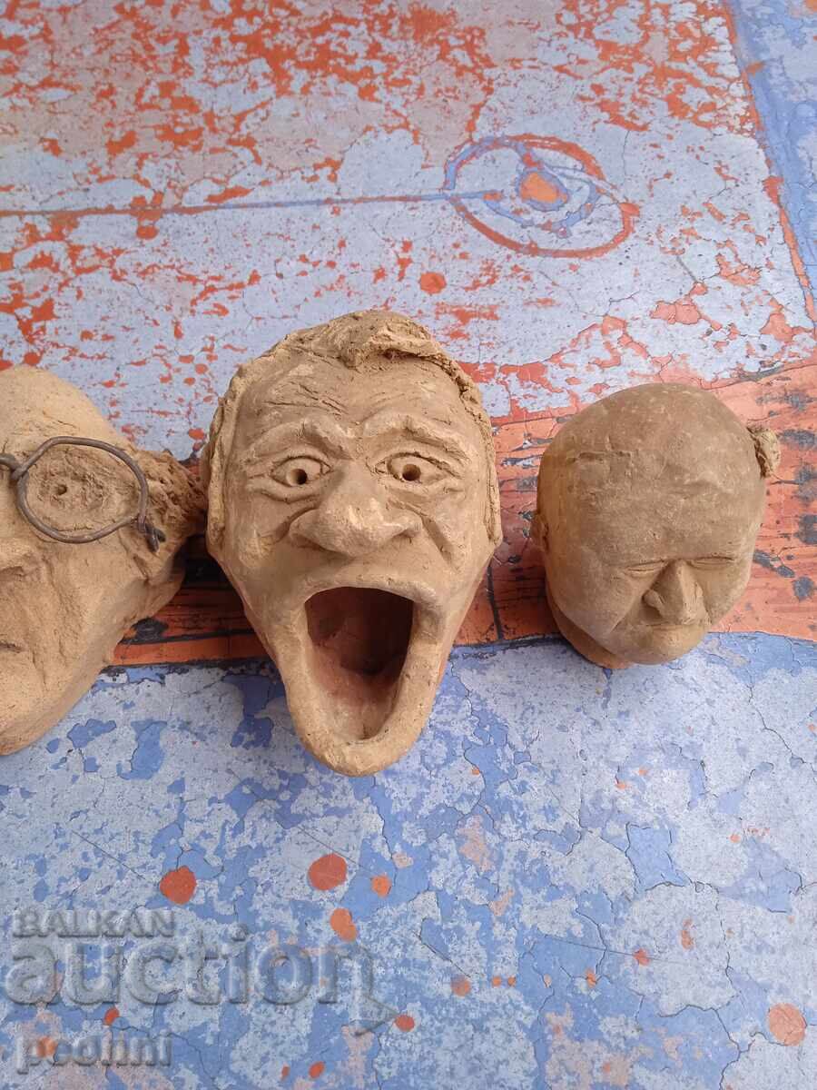 Auction  Three clay heads, handmade