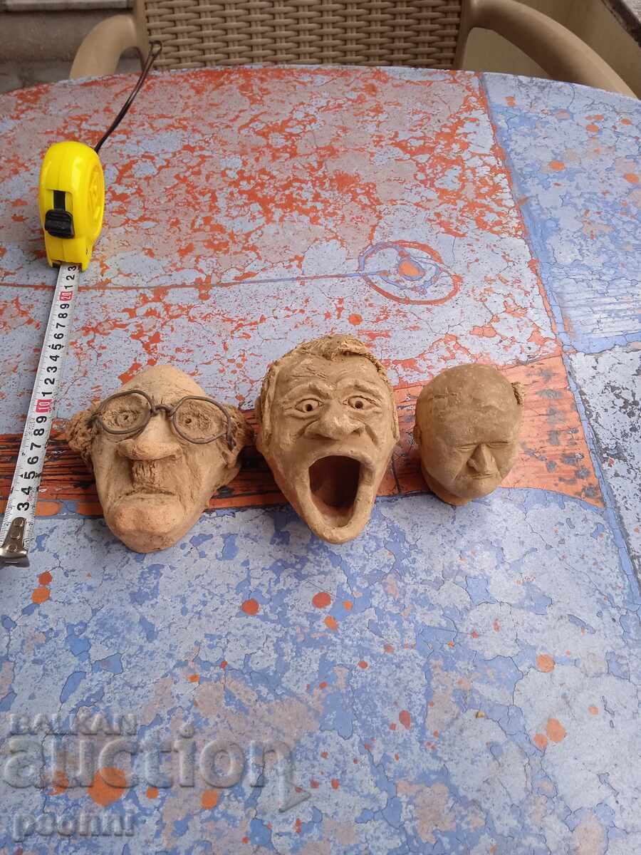 Three clay heads, handmade