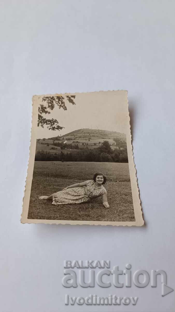 Photo Young girl lying on the grass Photo Young girl lying on the grass