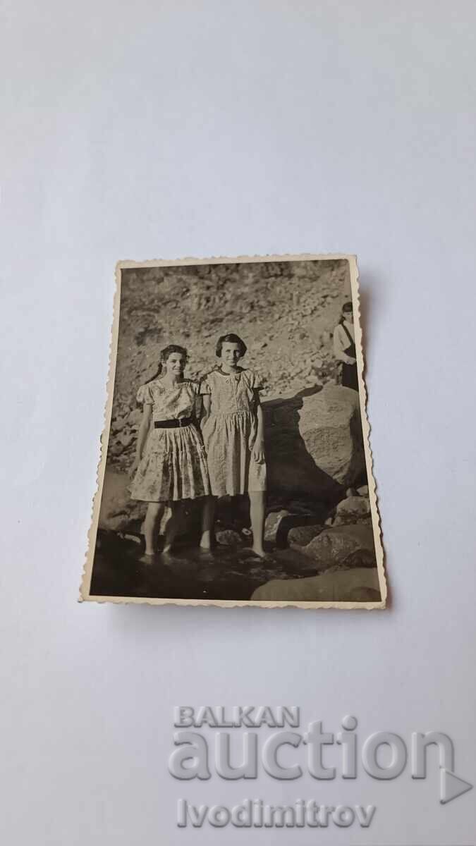 Picture Two young girls in the river