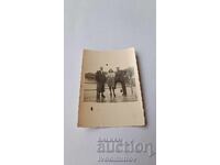 Photo Two men and a young girl on the pier