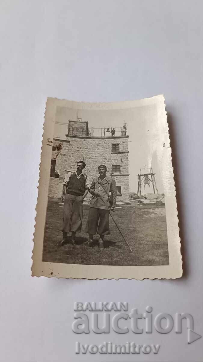 Photo Rila Two men in front of the meteorological station on Musala peak Photo Rila Two men in front of the meteorological station on Musala peak